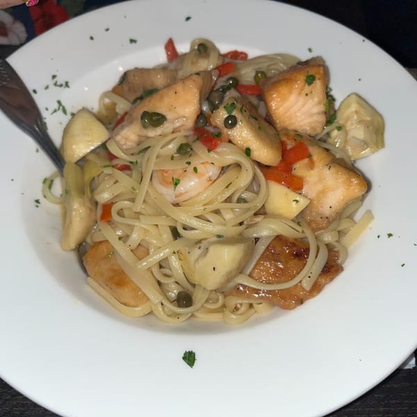 Bella Pasta's linguine with salmon, shrimp, artichokes, red peppers, and capers.